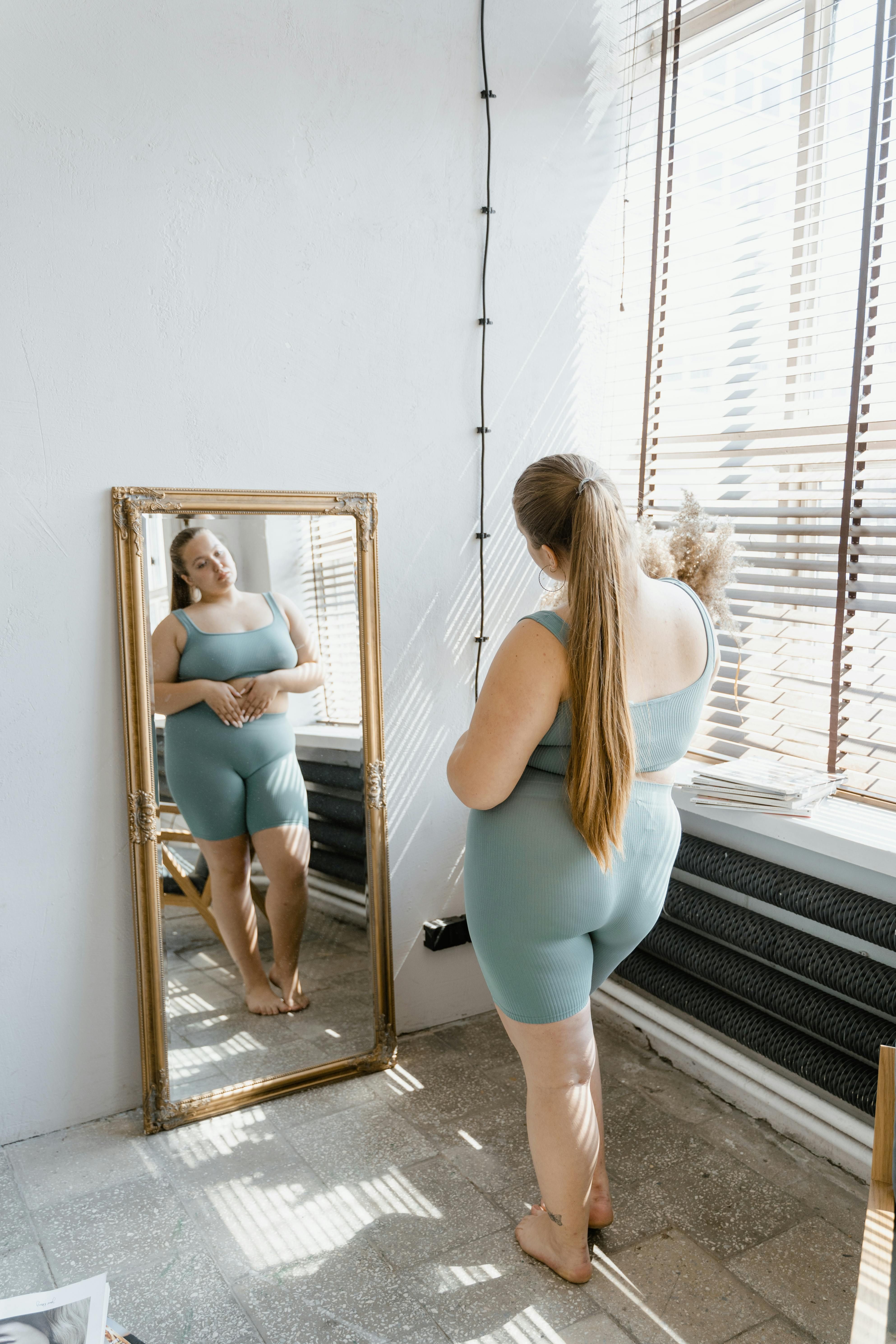 Woman looking in mirror